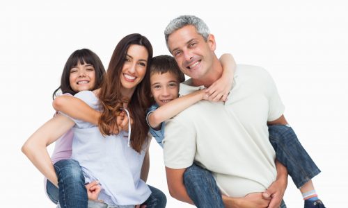 Smiling parents holding their children on backs on white background Smiling parents holding their children on backs on white background